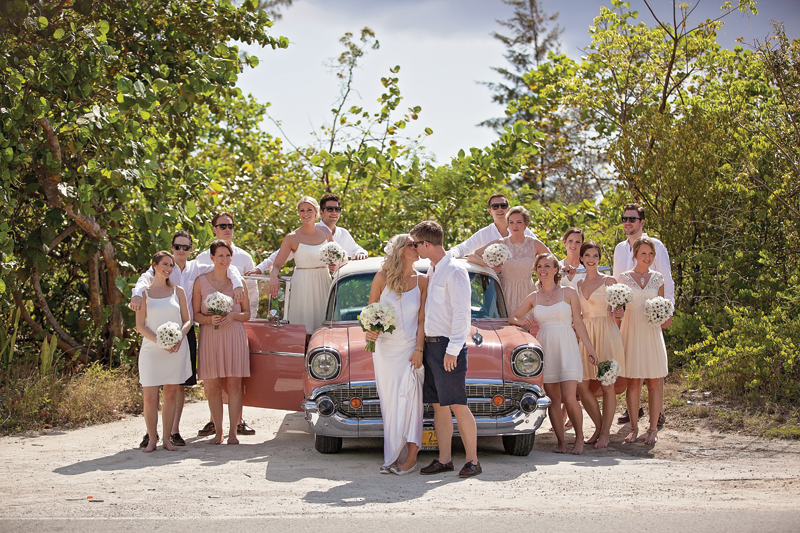 Wedding couple with guests